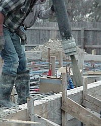 Beginning to 'place' concrete by filling the beams.